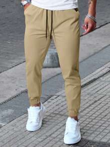 Manfinity Homme Pantaloni casual da uomo con coulisse in vita e tasche, pantaloni casual versatili, autunnali