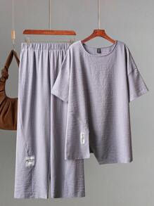 SHEIN Essnce Bộ đồ hai mảnh màu tím thời trang xuân hè rộng rãi thoải mái hàng ngày cho nữ cỡ lớn, áo ngắn tay và quần ống rộng, màu tím, trang phục mùa hè cho nữ, trang phục sân bay, bộ đồ mặc ở nhà cho nữ, bộ quần rộng thùng thình, quần áo mẹ và con gái, phong cách tiền cổ cho phụ nữ - Màu tím - Xem 6