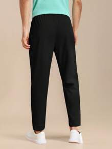 Manfinity Homme Pantalones casuales de unicolor para hombres con bolsillos y cordón en la cintura - Joggers negros para hombres - Ropa de hombre - Pantalones de hombre