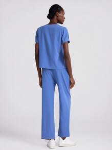 Scrubzie Scrub Uniform Set, Solid Color Short Sleeve Top And Long Pants, Minimalist And Fashionable, Suitable For Summer Running Nurse & Uniform Scrubs Handwashing Pocketed Breathable Brushed Clothing Set Scrub Stretchable Athletic Workwear With Pockets Scrub Top And Pants Set Women's Scrub Set: Notch V-Neck Tuck In Top & Straight Leg Pants Essential Jogger Scrub Set Nursing Uniform Stretch Top & Drawstring Cargo Pants - Baby Blue - View 2