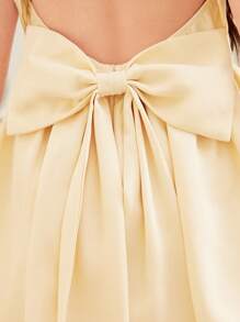 SHEIN Vestido elegante y de color amarillo pato para niñas preadolescentes, con cuello cuadrado de unicolor, sin mangas, espalda descubierta, decorado con gran lazo y empalme en forma de V. Vestido francés elegante y a la moda, ideal para volver al colegio, apropiado para graduaciones, bailes de promoción y fiestas de cumpleaños.