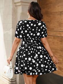 Celure Vestido ceñido con pliegues y lunares, en negro y blanco