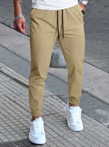 Manfinity Homme Pantaloni casual da uomo con coulisse in vita e tasche, pantaloni casual versatili, autunnali