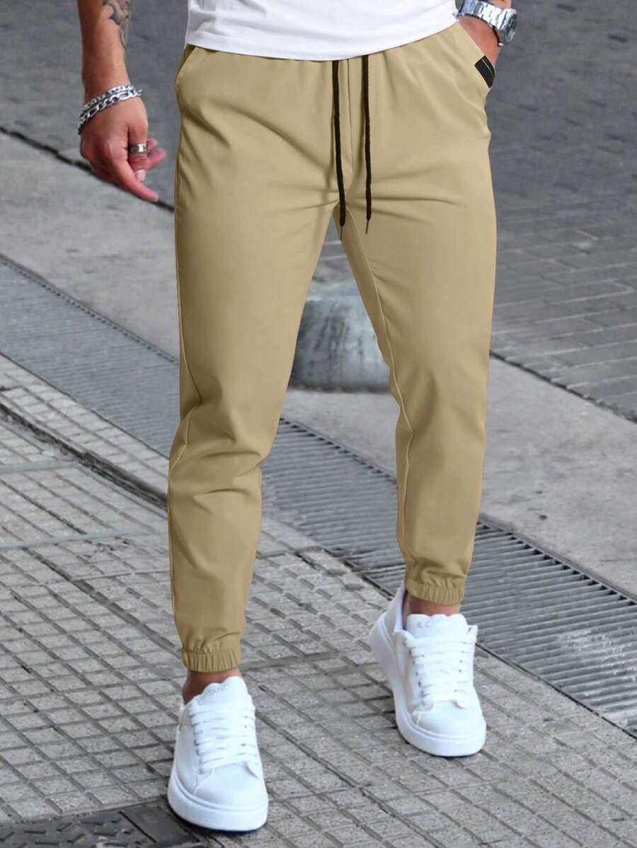 Manfinity Homme Pantaloni casual da uomo con coulisse in vita e tasche, pantaloni casual versatili, autunnali