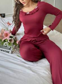 Women's Ruffle Hem Long Sleeve Top And Flared Pants Pajama Set