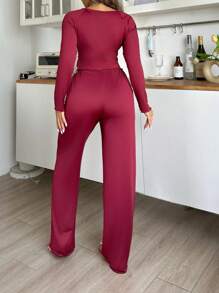 Women's Ruffle Hem Long Sleeve Top And Flared Pants Pajama Set