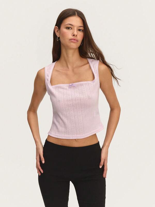 Nöista 方形领口和精致缎带细节的镂空短袖上衣。田园风格，适合复活节、野餐或毕业典礼。