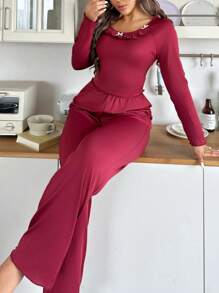 Women's Ruffle Hem Long Sleeve Top And Flared Pants Pajama Set