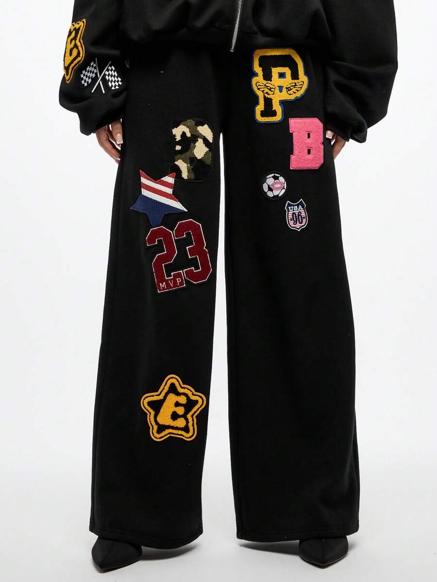 SUMWON WOMEN 大学徽章贴片慢跑运动裤学院运动贴花运动休闲运动裤复古字母风格校园休闲街头休闲舒适宽松秋冬 - 黑色 - 查看 1