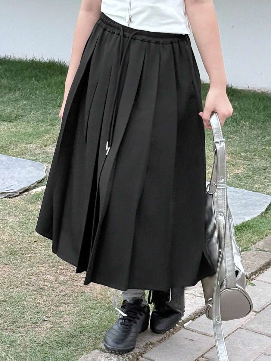 Dazy Kids Váy xếp ly trơn màu đơn giản đa năng cho bé gái tuổi mới lớn - màu đen - Xem 1