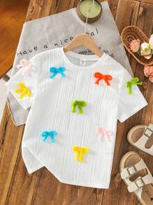 Top de manga corta y cuello redondo ajustado de tejido jacquard con decoración de lazo colorido, apropiado para primavera/verano, salidas de primavera, y vuelta al colegio, para niñas preadolescentes - Blanco - Ver 1