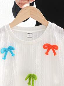 Top de manga corta y cuello redondo ajustado de tejido jacquard con decoración de lazo colorido, apropiado para primavera/verano, salidas de primavera, y vuelta al colegio, para niñas preadolescentes - Blanco - Ver 11