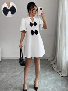 Elenzga Vestido mini de unicolor con cuello en V, mangas abullonadas y decoración de lazo, para mujer, nuevo para primavera/verano, de estilo casual y elegante - Blanco - Ver 1