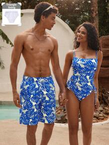 Manfinity VDAYZ 1 pieza Pantalón corto de playa holgado con estampado de planta tropical y cordón en la cintura para hombres, traje de baño a juego para parejas, estilo hawaiano