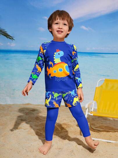 SHEIN Young Boys Swimwear,Boys Outfit Sets,Traditional Arabic Clothing,Middle Eastern Style Long-Sleeved Shirt And Long Pants Set,This Two-Piece Swimsuit Set For Boys Is Perfect For Beach Vacations.  It Features A Cute Cartoon Dinosaur Print, Long Sleeves, And Long Pants For Sun Protection, Making It Ideal For Spring And Summer Holidays, Swimming, Beach Trips, Pool Time, Surfing, And Summer Swimming Vacations.