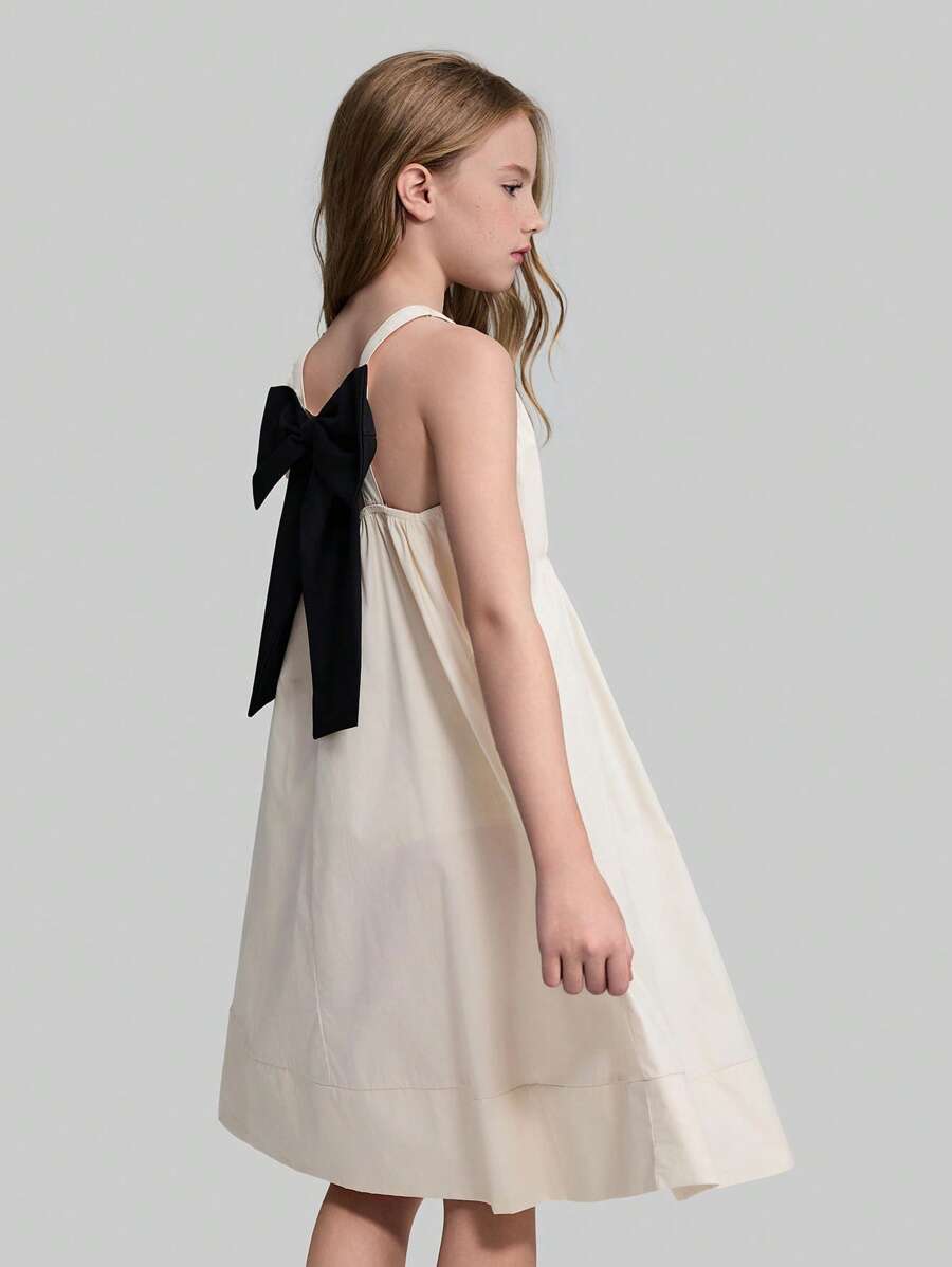 Ontre Tween Girls' Casual Loose Strappy Backless Dress With Exaggerated Bow Decor, Minimalist Plain Color, Suitable For Outdoor, Home, School, Beach, Holiday - Apricot - View 1