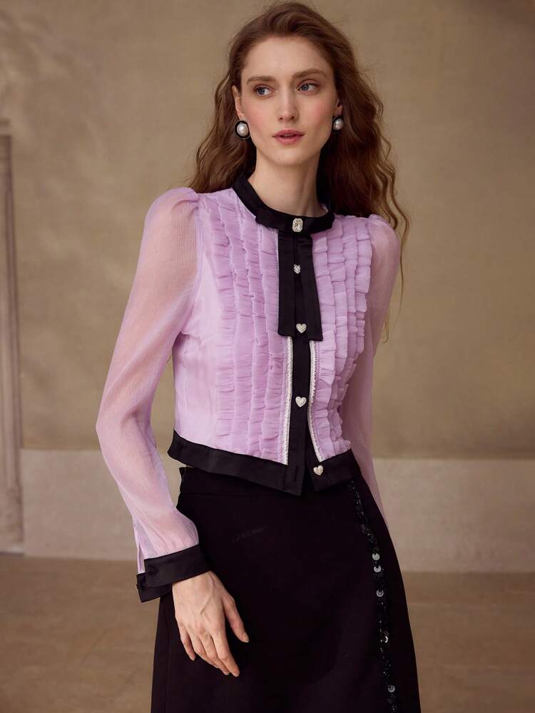 Blusa con decoración de lazo y bloques de color