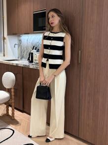 Pariaura Top ajustado de punto con abertura y botón metálico asimétrico en el bajo, cuello redondo, de estilo francés minimalista y de moda, a rayas en blanco y negro, versátil, de tejido liso, para uso diario, viajes y vacaciones, apto para primavera/verano/otoño