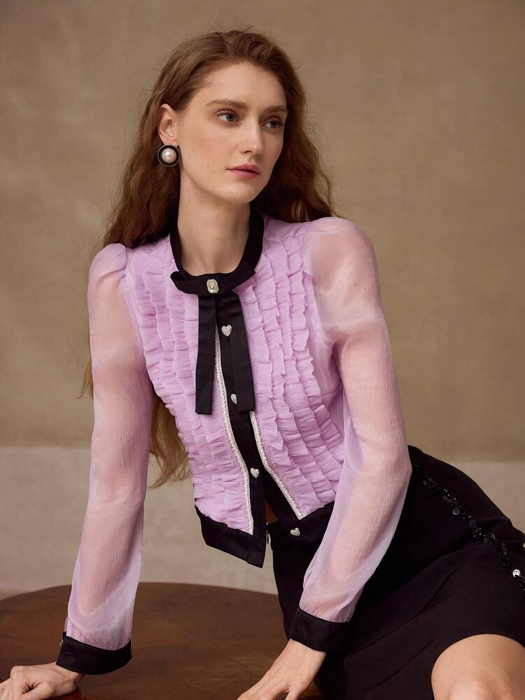 Blusa con decoración de lazo y bloques de color