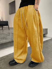 Manfinity Homme Pantalones deportivos casuales para hombre de unicolor con cordón en la cintura y bolsillos, pantalones deportivos versátiles con pernera ancha y holgada