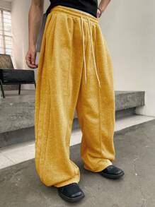 Manfinity Homme Pantalones deportivos casuales para hombre de unicolor con cordón en la cintura y bolsillos, pantalones deportivos versátiles con pernera ancha y holgada