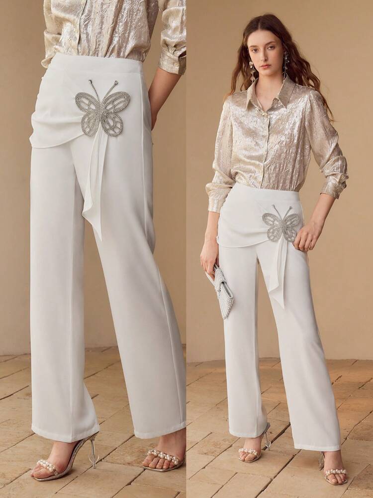 Pantaloni eleganti con decorazione di farfalle in strass