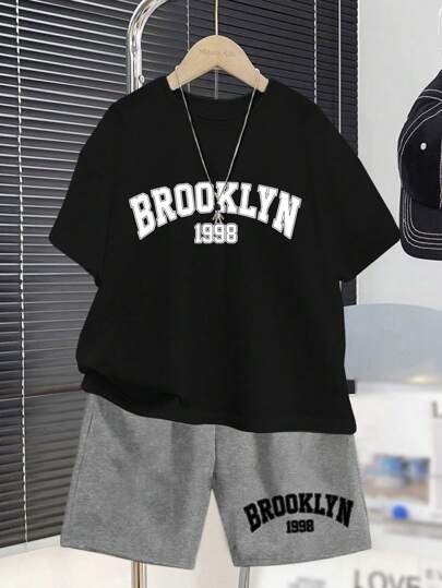 SHEIN Conjunto de 2 piezas de camiseta de manga corta de cuello redondo simple y pantalones cortos casuales para niños preadolescentes, adecuado para el verano