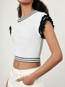 Maija Nuevo diseño de verano 2025 Blusa sin mangas de punto de diseño minimalista con empalmado blanco y negro, abertura calada, volante en el bajo, adecuada para playa, diario, fiesta informal, invitada de boda, festival de música, graduación