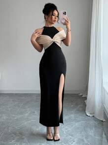 Calvaya Elegante abito color block nero e beige con spacco alto sulla schiena