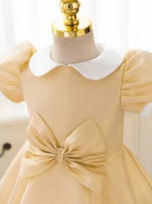 فستان أميرة ذو أكمام متنفخة فاخر وذهبي اللون مزين بشريط للخصر مناسب للحفلات الرسمية والأعياد