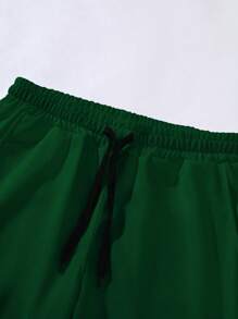 Manfinity LEGND Pantalón de chándal con cordón en la cintura con estampado de letra de ángel para hombres