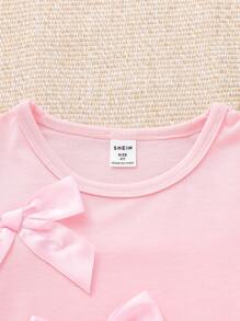 SHEIN Vintaside Kids مجموعة بقطعتين تيشيرت بياقة دائرية وأكمام قصيرة مزخرف بفيونكه وأكمام منتفخة + بنطال جينز أزرق واسع الساق بخصر مطاطي، إطلالة صيفية كاجوال جميلة للفتيات الصغيرات - متعدد الألوان - مشاهدة 7