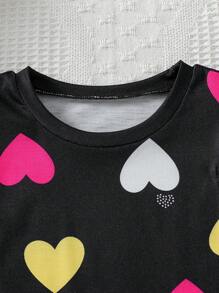 Set de 2 piezas de Top de manga corta con estampado de corazón colorido y falda corta con decoración de moño para niña, conjunto de vestir de verano