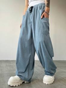 Manfinity Streetrush Pantalon large en velours côtelé pour homme, style streetwear, avec grande poche et conception de broderie de machette fendue