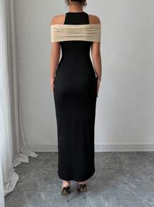 Calvaya Elegante abito color block nero e beige con spacco alto sulla schiena