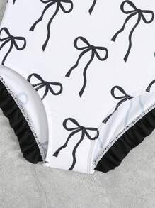 Young Girls One-Pieces - Adorable Black Bow One-Piece Swimsuit. Features Soft Knitted Fabric, Contrast Color Ruffle Trim On Shoulders, And A Classic Bow Accent. Fashionable, Casual, Yet Chic Design. Perfect For Swimming, Summer Vacations, Beach Trips, Pool Parties, And Holiday Getaways. - Black and White - View 3