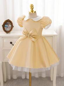 فستان أميرة ذو أكمام متنفخة فاخر وذهبي اللون مزين بشريط للخصر مناسب للحفلات الرسمية والأعياد