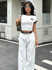 SHEIN Conjunto de blusa manga corta a contraste y pantalón ancho de pierna suelta en color blanco, look deportivo y urbano para adolescentes