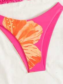 Swim Mod Set bikini da donna composto da un top con spalline e schiena scoperta decorato con stampe colorate e un abbinato pantaloncino corto con fantasia floreale, adatto per le vacanze primavera