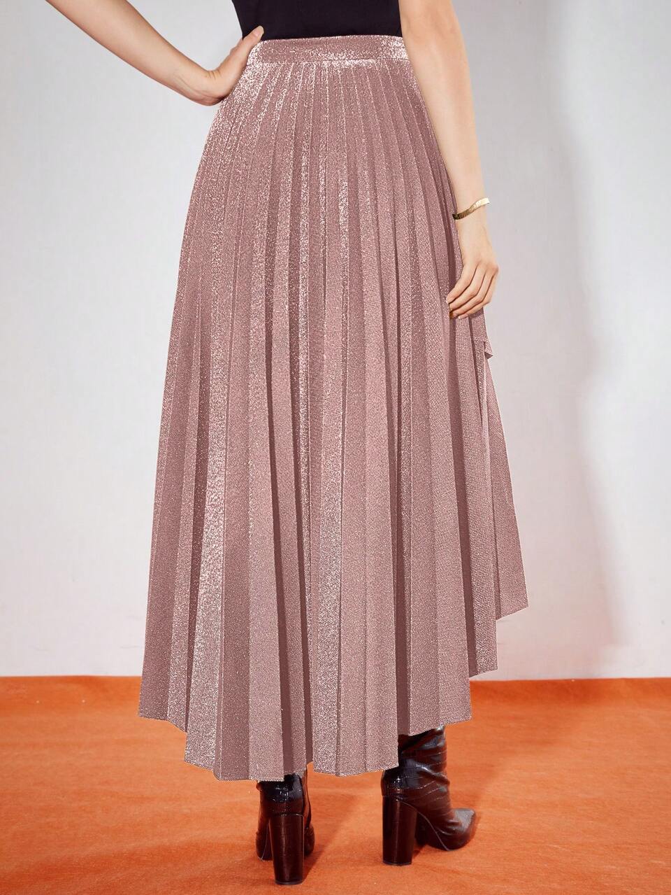PLEATED ASYMMETRICAL HEM SKIRT
