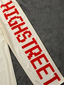 SHEIN مجموعة تي شيرت رياضي أكمام قصيرة فضفاض بطباعة كرة القدم ملابس الرياضة الفضفاضة وبناطيل رياضية فضفاضة مطبوع عليها حرف لمراهقين