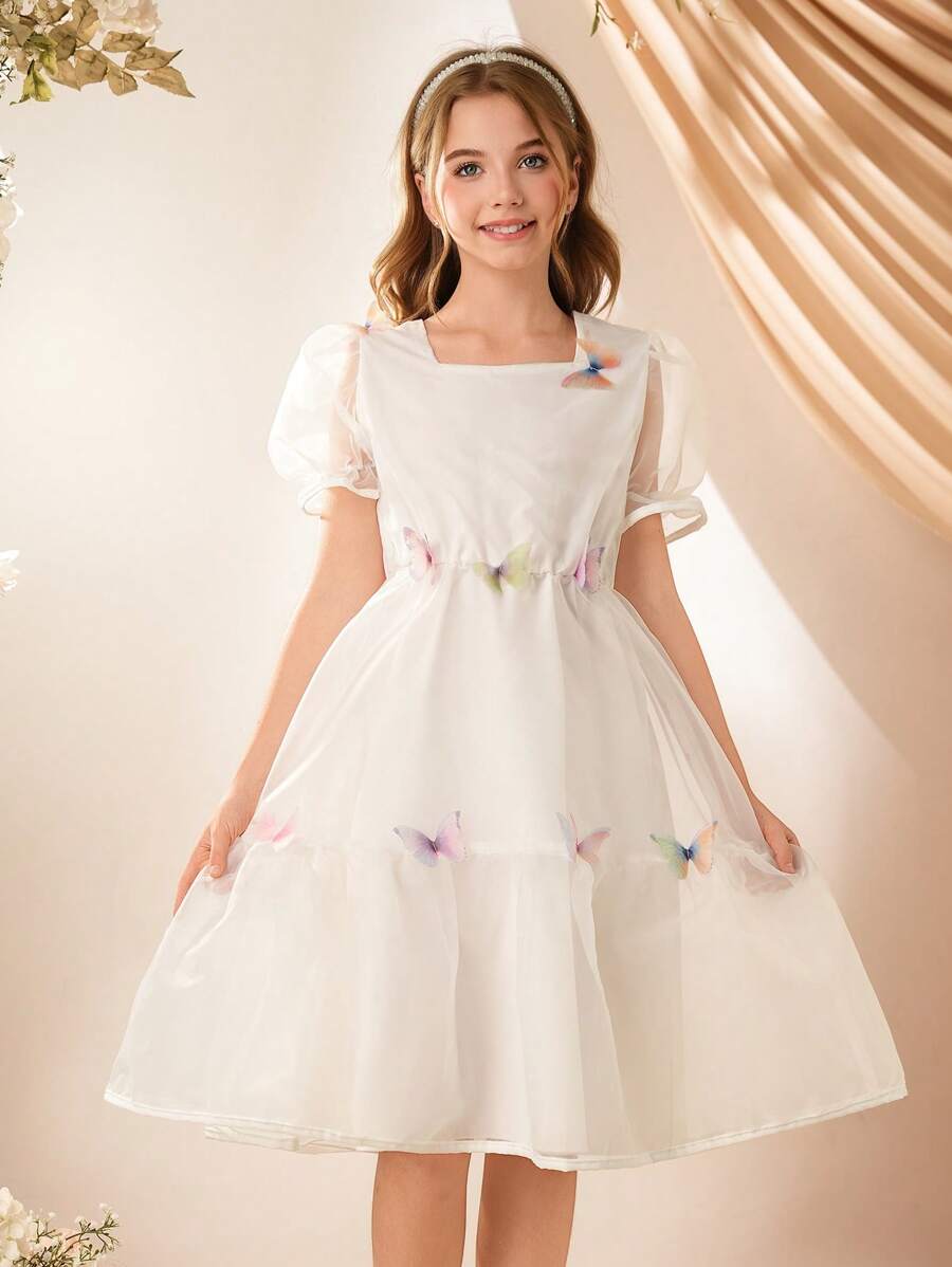 SHEIN Vestido elegante y lujoso para niñas, vestido de tela de gasa ligera de color blanco crema, vestido de princesa con cintura alta de toque de seda glacial de organza, con decoración de doble capa de tul con mariposas arcoíris, estilo de súper princesa de hadas para el verano - Blanco - Ver 1