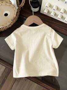 SHEIN Camiseta de manga corta holgada de cuello redondo minimalista casual para niños, adecuada para el verano