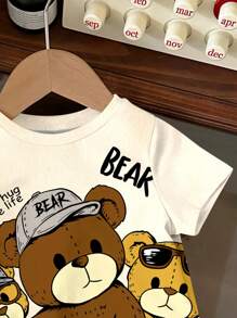 SHEIN Camiseta de manga corta holgada de cuello redondo minimalista casual para niños, adecuada para el verano