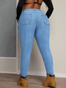 SHEIN SXY Jeans in denim elasticizzato con design a spacchi simmetrici per taglie comode