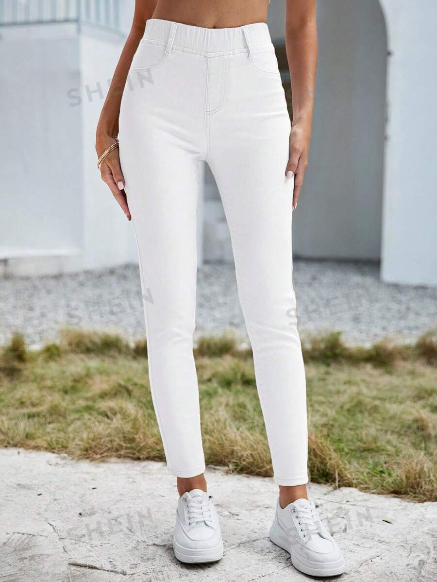 SHEIN Essnce Pantalones largos de mezclilla llanos, simples y de moda, apropiados para el verano