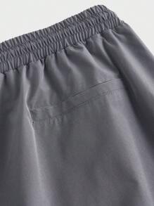 Manfinity VCAY 大码男士黑灰色宽松梭织长裤，街头风格