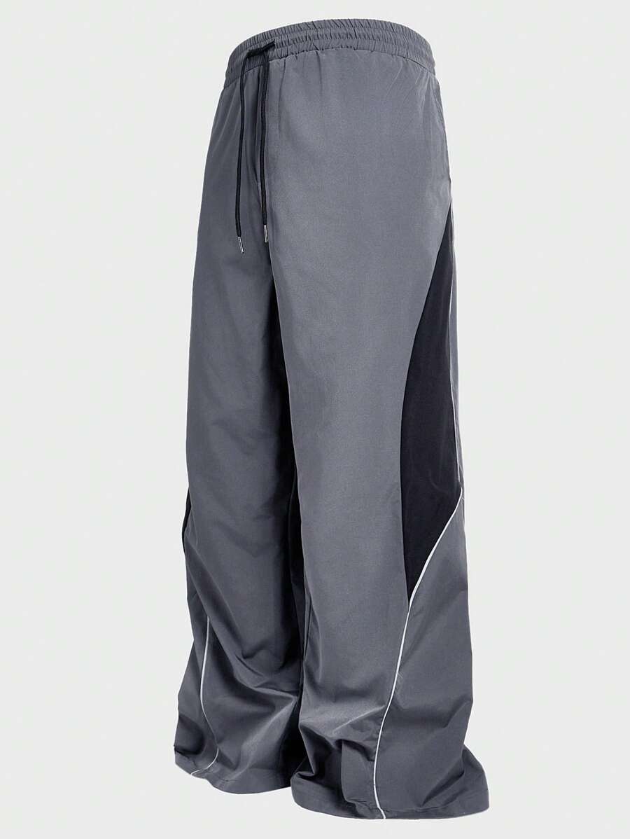 Manfinity VCAY 大码男士黑灰色宽松梭织长裤，街头风格