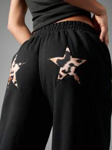 MISSGUIDED Leopard Star Print Wide Leg Athletic Joggers Palazzo Style Loungewear Yoga Dance Pants Comfortable Elasticized Waistband Holiday Winter Workout Bottoms - Black - View 3