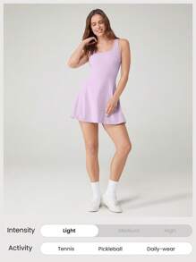 GLOWMODE Vestido activo con pantalones cortos incorporados, bolsillos laterales, agarre antideslizante y escote de tipo pico con tirantes cruzados en la espalda, diseño transpirable y de secado rápido "FeatherFit ™-Air" pensado para ganar, adecuado para tenis, golf, pickleball y uso diario